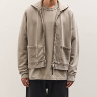 Man wearing a beige jacket with a white background