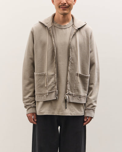 Man wearing a beige jacket with a white background