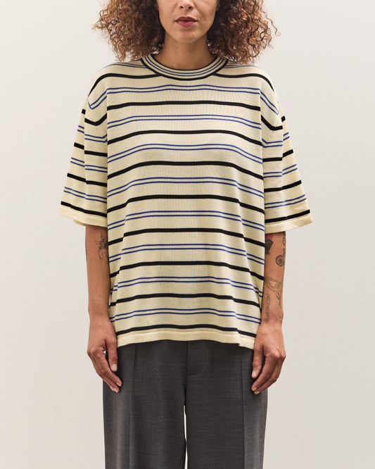 Person wearing a striped shirt against a plain background