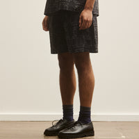 Henrik Vibskov Unisex Waybill Shorts, Black Punched Boxes